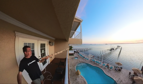 Wade VanLandingham tuning a ground station from a balcony